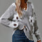 PAULA | SUÉTER FLORAL ELEGANTE CON ESCOTE EN V Alba Madrid