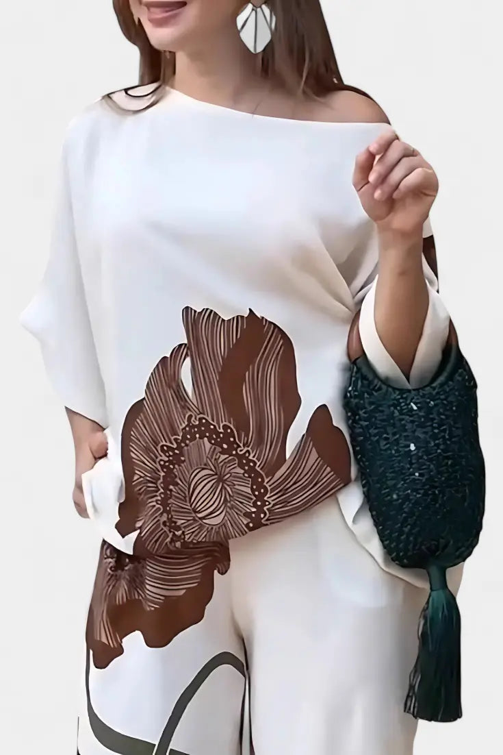 Sybella | Conjunto Floral de Dos Piezas con Hombro Descubierto y Pantalón Recto Alba Madrid